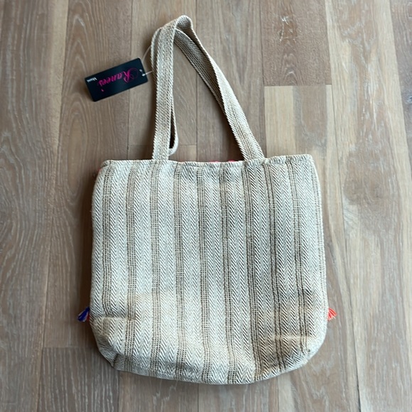 NWT. Pom Pom boho style tote. Lined w/ zip pocket & snap closure. Bright colors. - Picture 5 of 7